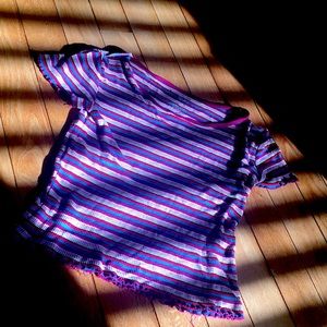 pink and red and yellow and blue and white it is a beautiful shirt❤️